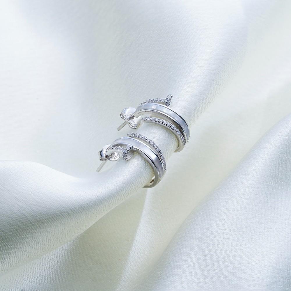 Reegalia Classic Curve Huggie Hoops in 925 Silver.